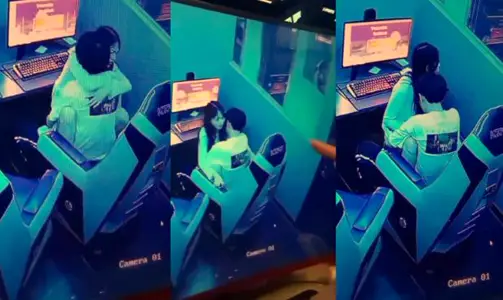 山东某网吧监控偷拍，一对年轻情侣趁私下无人在网吧座椅上操逼偷情